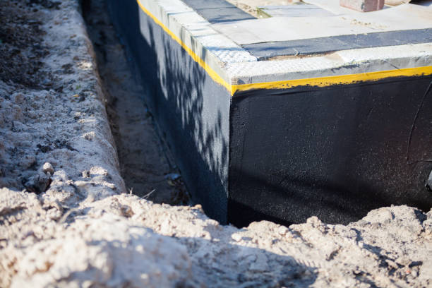 Professional Waterproofing technician working in Piscataway, NJ